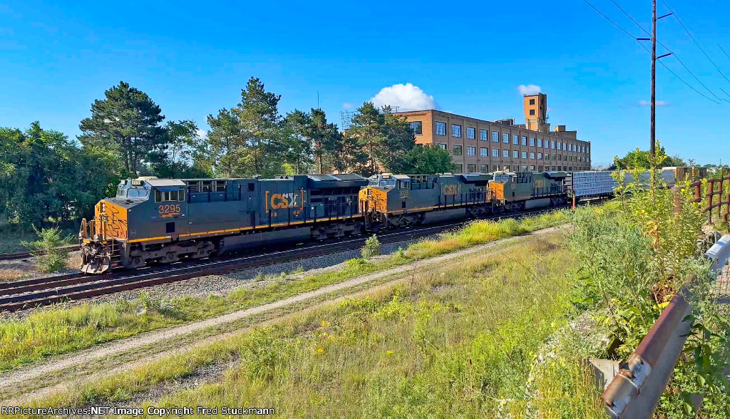 CSX 3295 leads M370 past the one time Firestone Tire & Rubber Co.